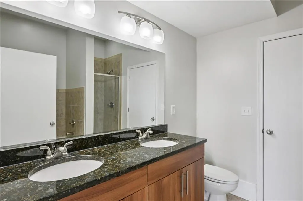 Spa-style primary bathroom featuring a separate shower, double vanity, and large soaking tub!
