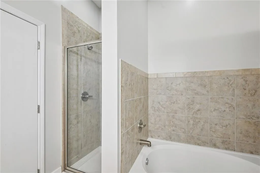 Primary Bath has separate shower and garden tub.