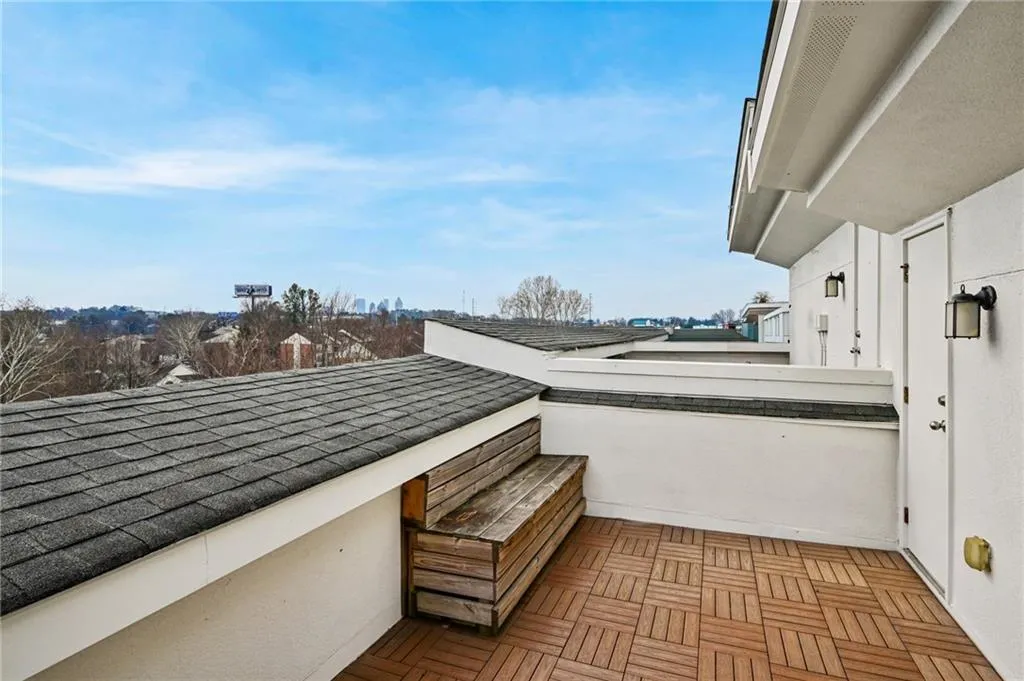 Rooftop deck features a bench, durable flooring and a great view of Midtown.