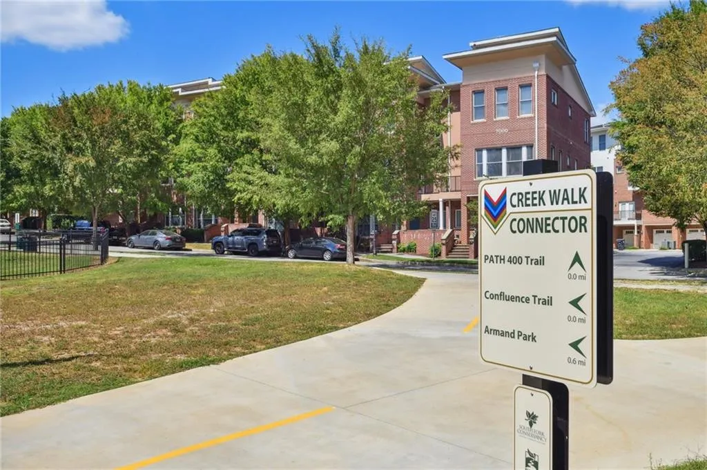 Summertime view of front of unit on other side of SUV in photo. Fountainhead Lane is a pretty street with plenty of parking.