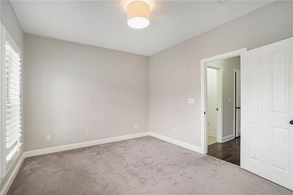 Carpeted spare room with a wealth of natural light