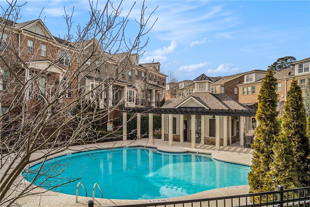 View of swimming pool with a patio area