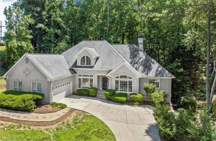 Visit 3600goldenroddrive.com/mls for more information. Charming curb appeal and a wooded backdrop set the tone for this serene and private retreat in a prime location within a top-rated school district minutes from Avalon and Downtown Alpharetta.