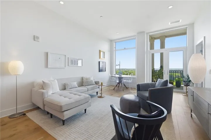 High ceilings, recessed lighting, and wood-finish flooring