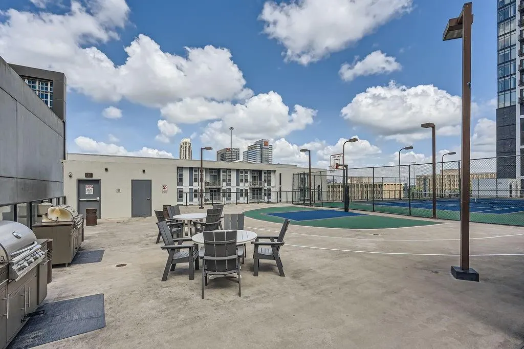 View of patio with area for grilling and community basketball court