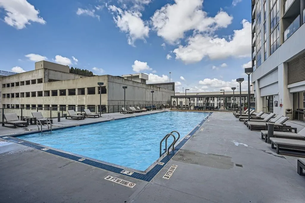 Community pool featuring a patio area
