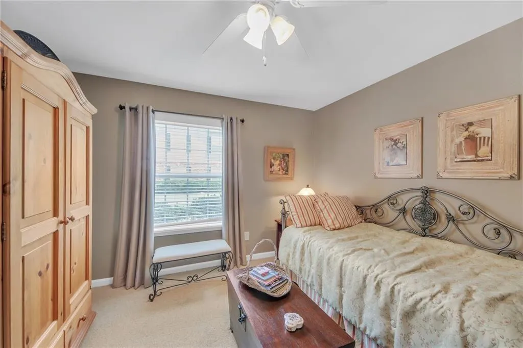 Second bedroom with great color and ceiling fan