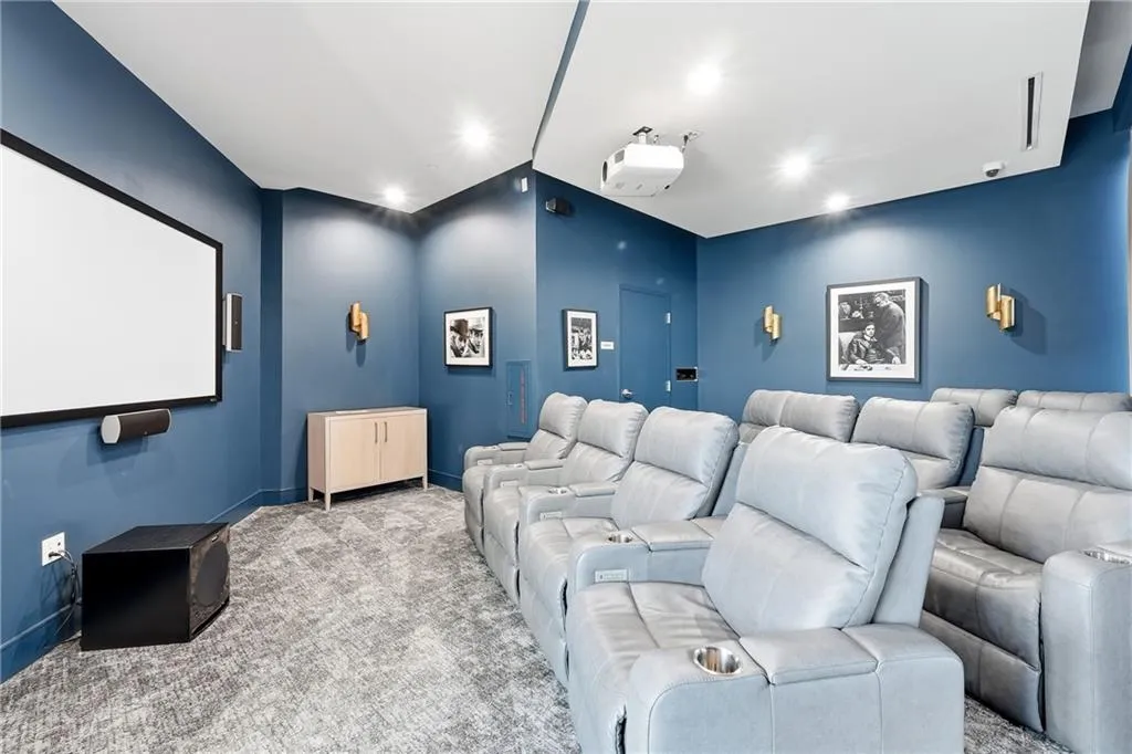 Cinema with carpet floors and recessed lighting