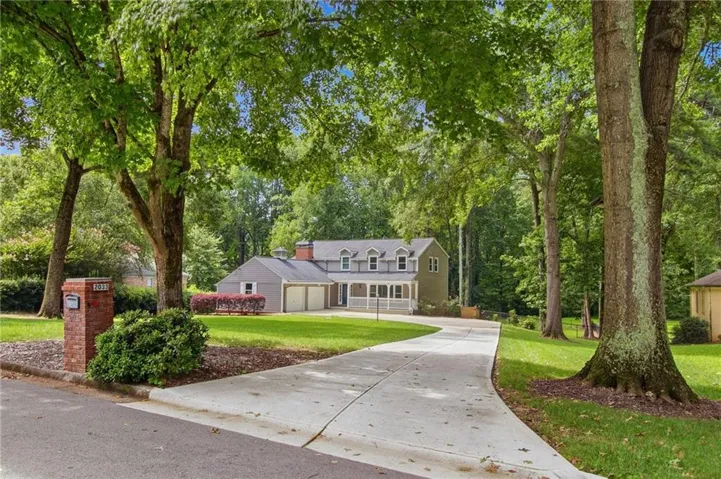 Paved driveway leading to a two-car garage