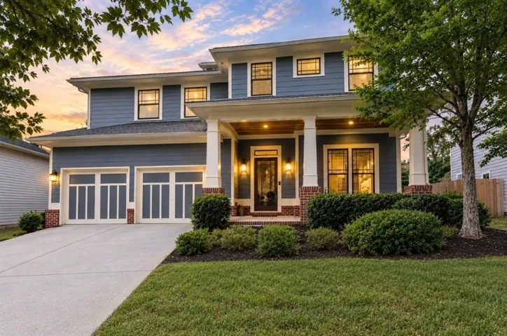 Two-story residence featuring blue siding and white trim