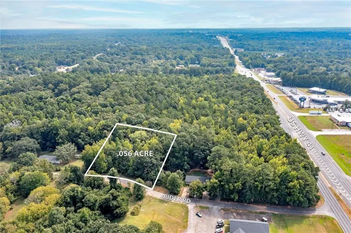 Wooded .056 acre lot with road frontage on Rider Road