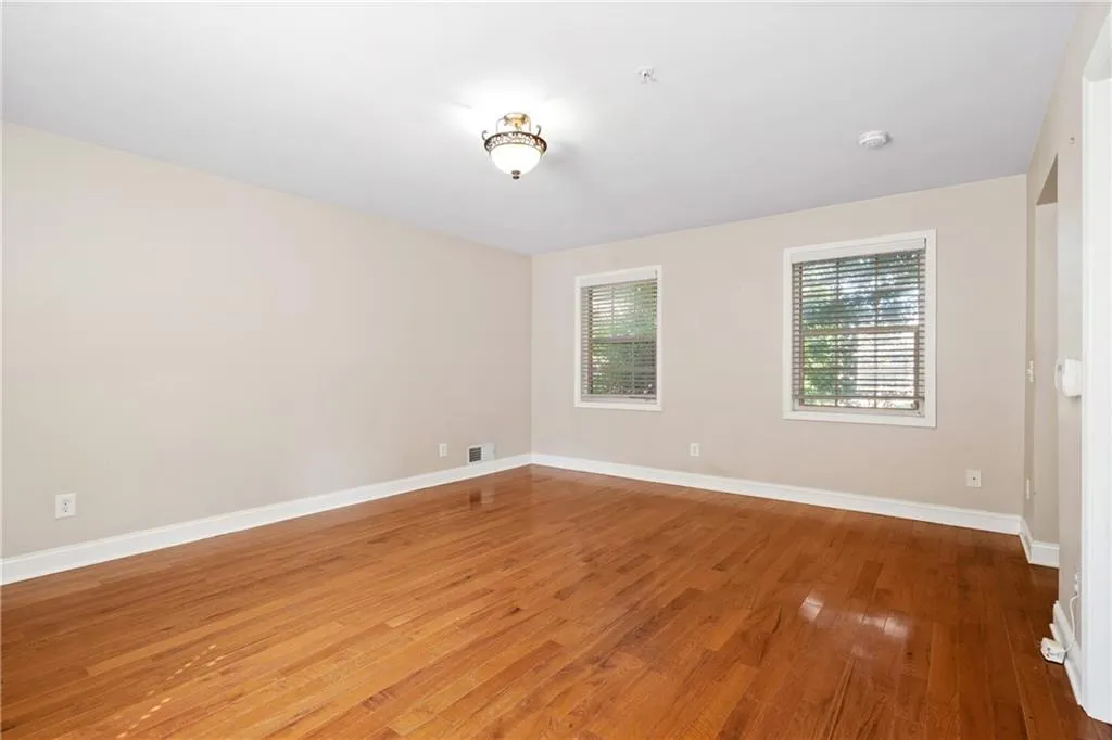 Empty room featuring light wood-type flooring