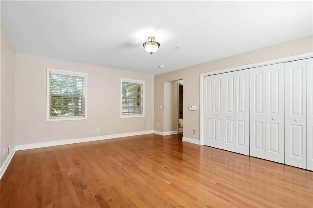 Unfurnished bedroom featuring light wood-type flooring
