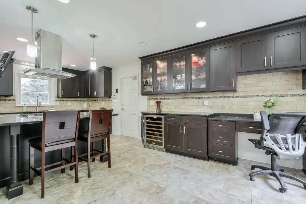 Kitchen featuring a desk and wine cooler
