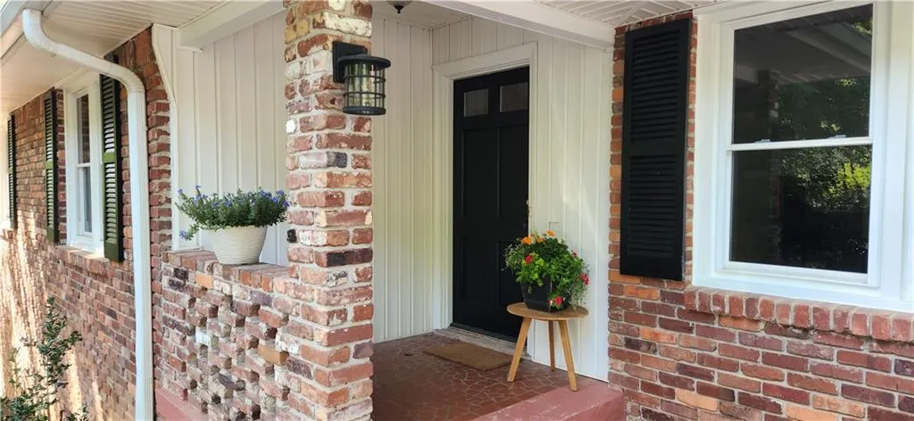 Entrance to property with a porch