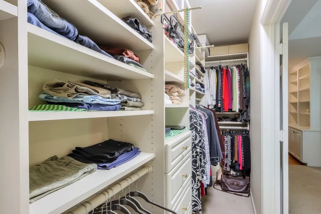 Walk in closet featuring carpet flooring