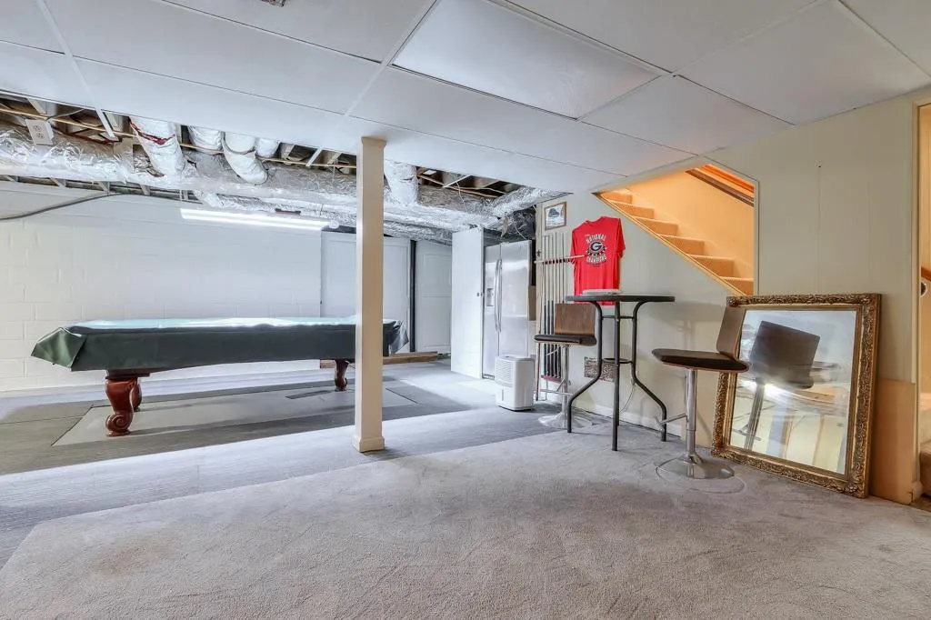 Basement with pool table and carpet