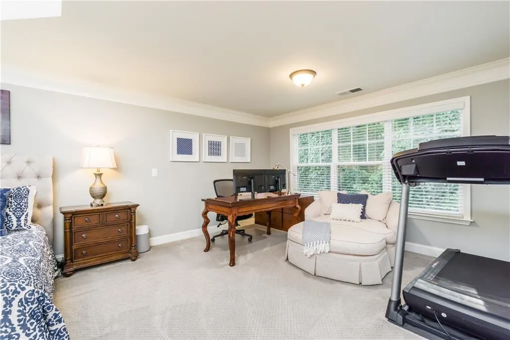 Office featuring ornamental molding and carpet floors