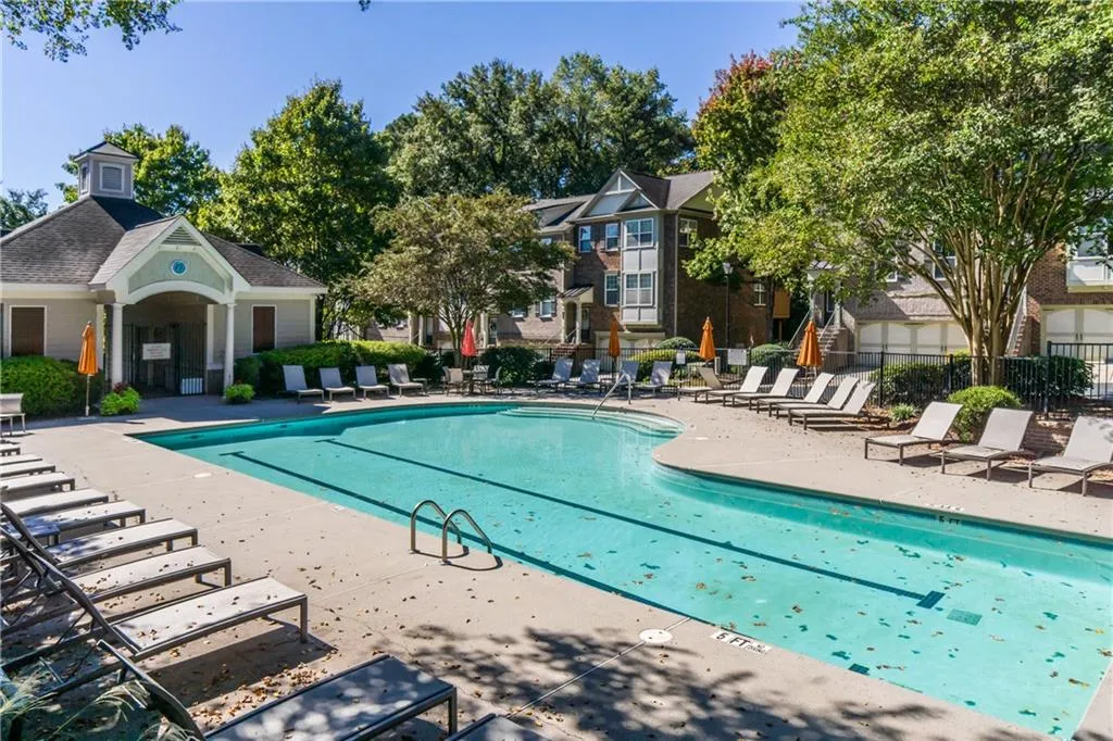 Community pool featuring a patio area