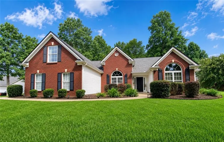 Red brick exterior with white siding accents