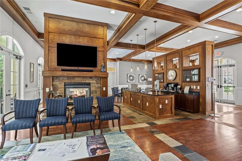 Clubhouse with coffered ceiling, dark hardwood / wood-style floors, and french doors