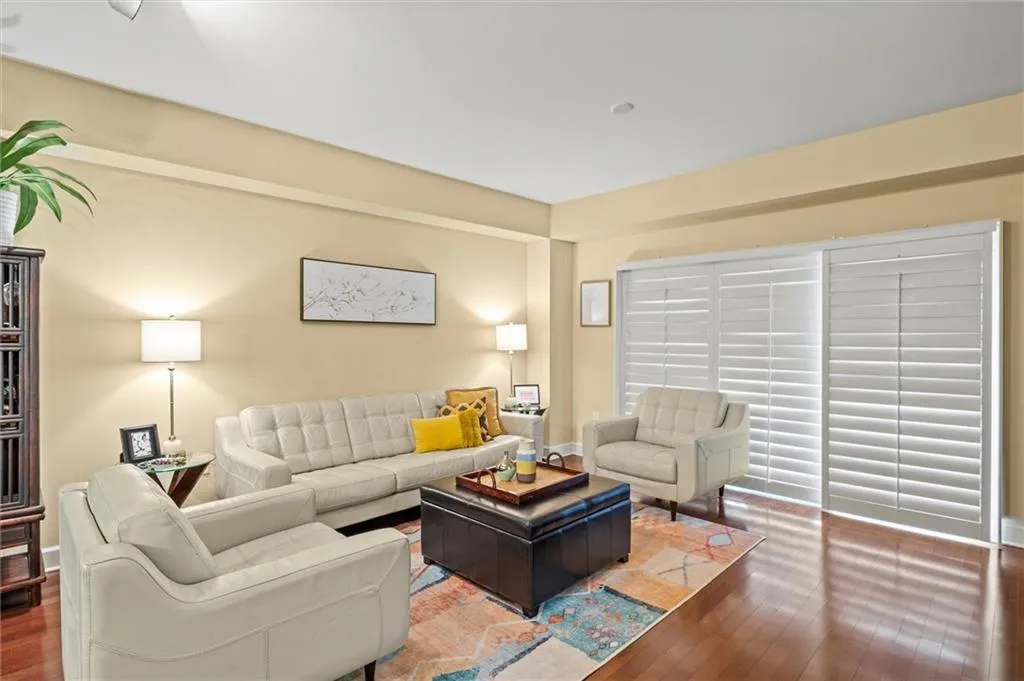 Living room featuring hardwood / plantation shutters