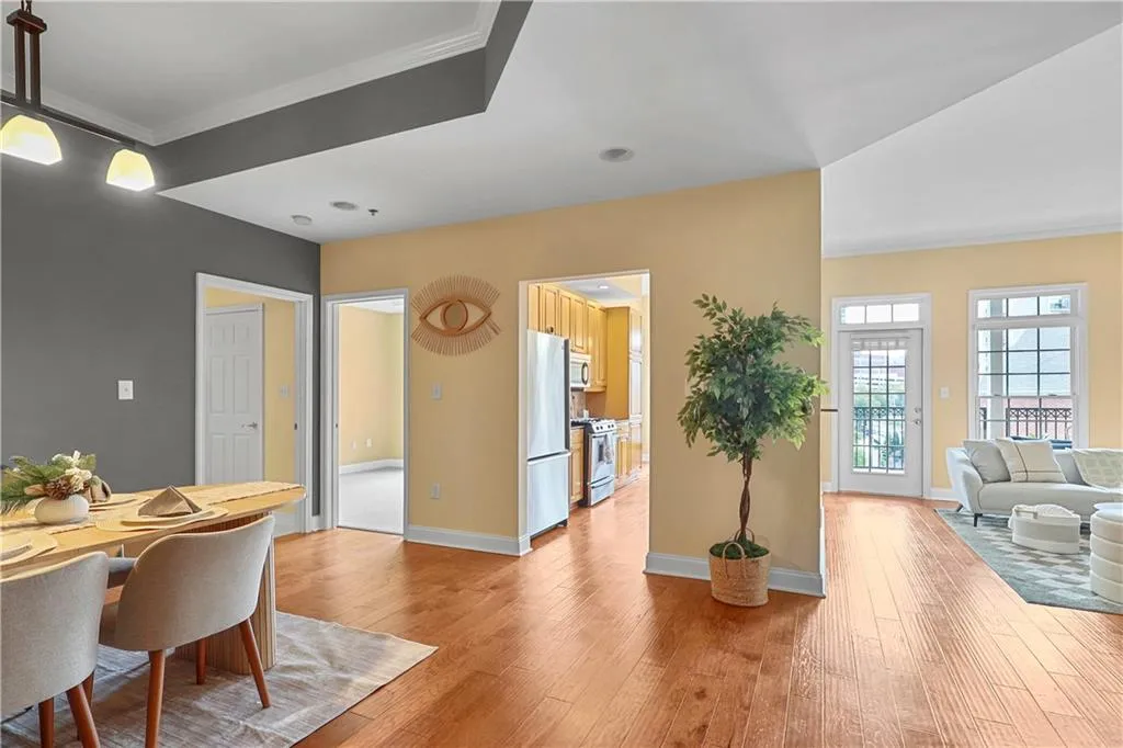 Dining room featuring light wood-style flooring and crown molding