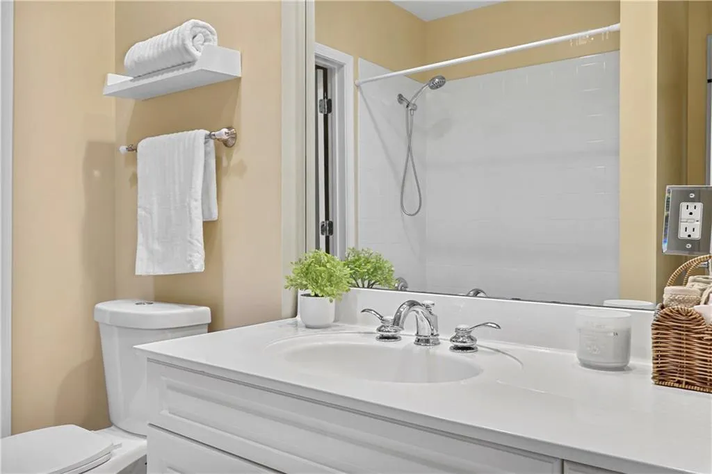 Full bathroom with vanity and a shower