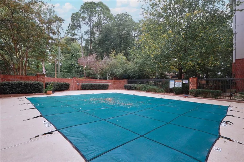 Community pool with a patio