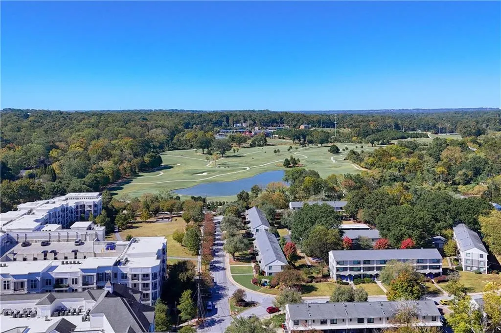 Bird's eye view of a nearby body of water and a golf club