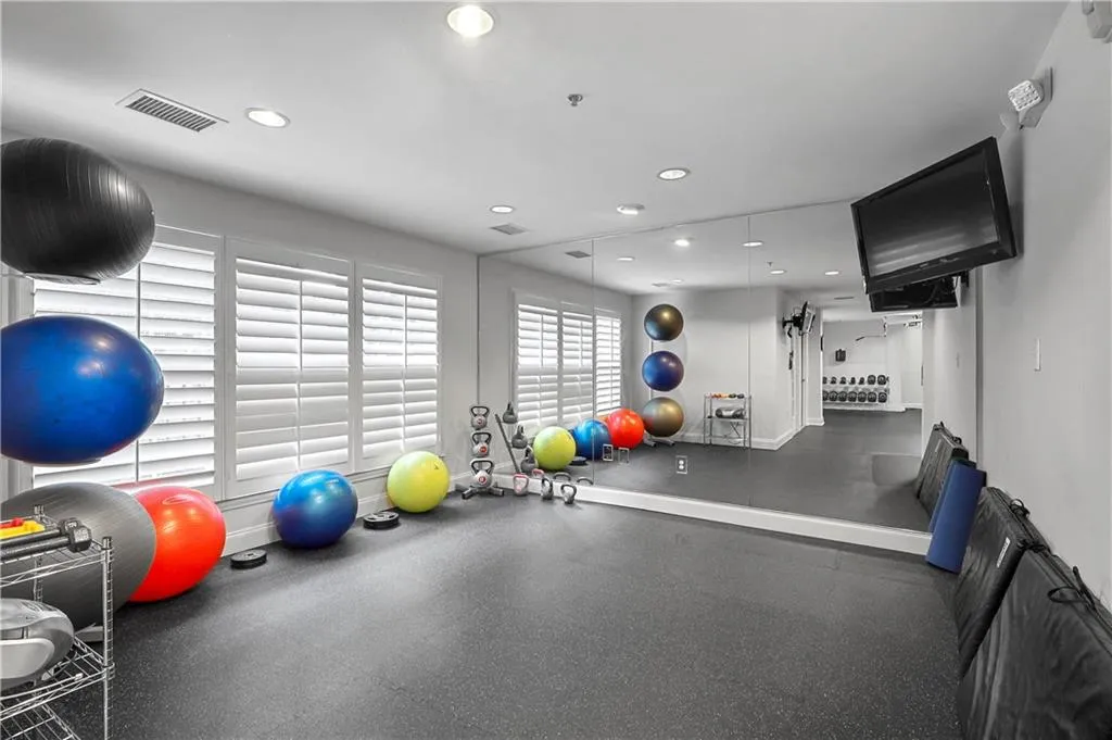 Gym featuring recessed lighting