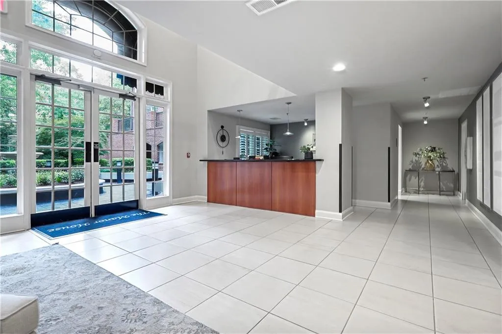 Reception featuring recessed lighting and a high ceiling