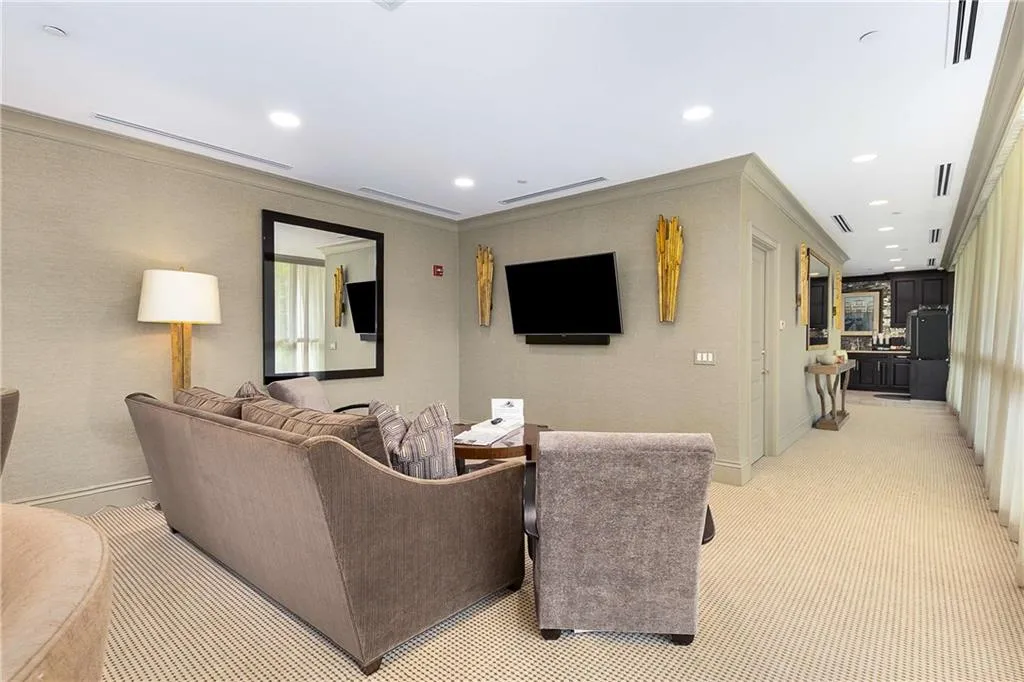 Social room featuring light carpet, recessed lighting, and crown molding