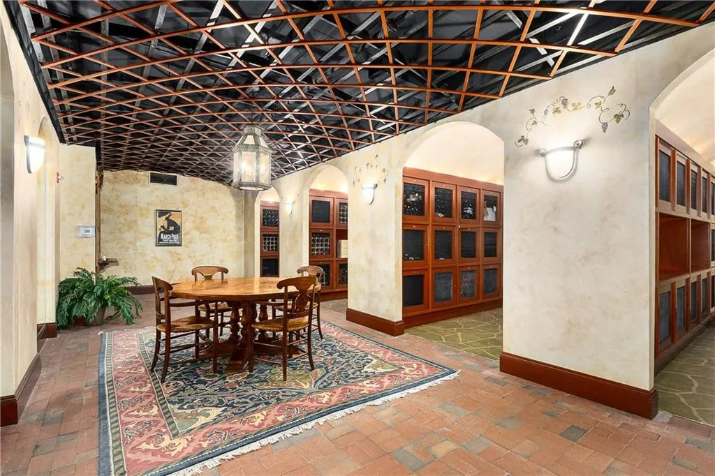 Wine cellar with arched walkways and brick flooring