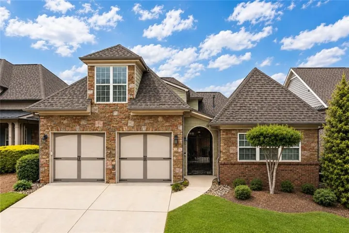 Welcome to the Morningside Plan.  Home features a NEW ROOF with brick and stone exterior for super low maintenance.  Gate opens to a courtyard.