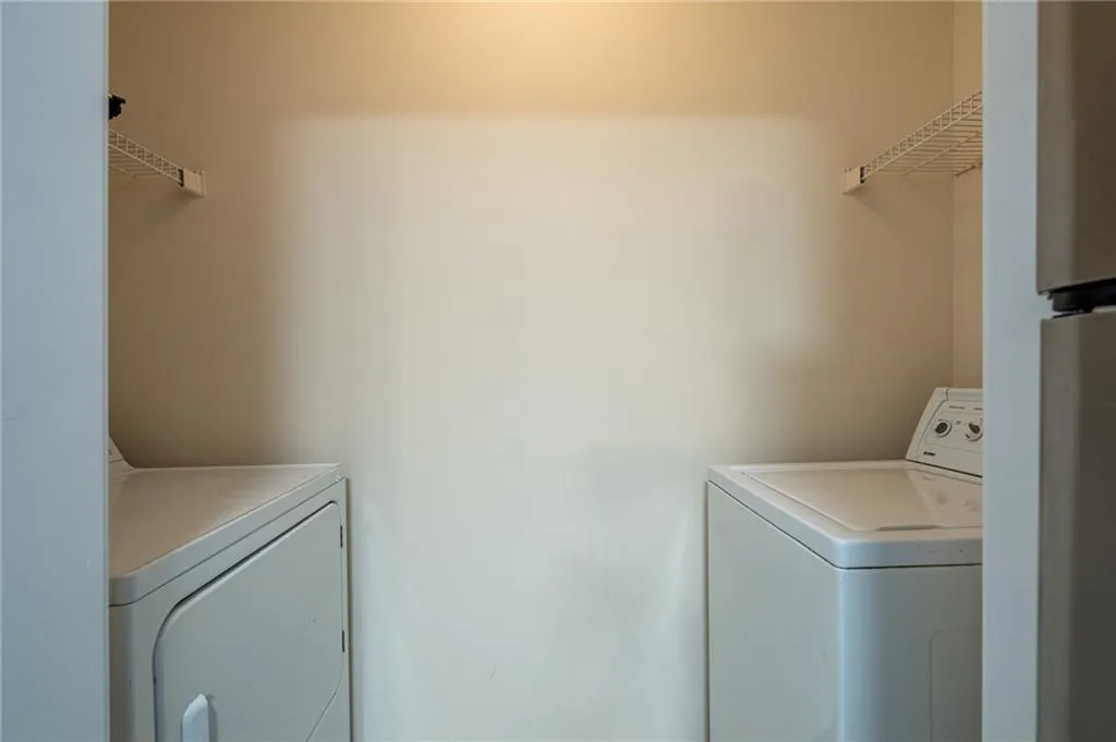 Laundry room featuring separate washer and dryer