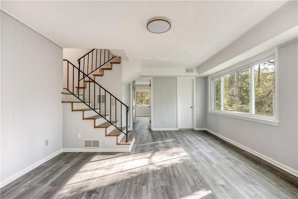 Entryway with dark hardwood / wood-style flooring