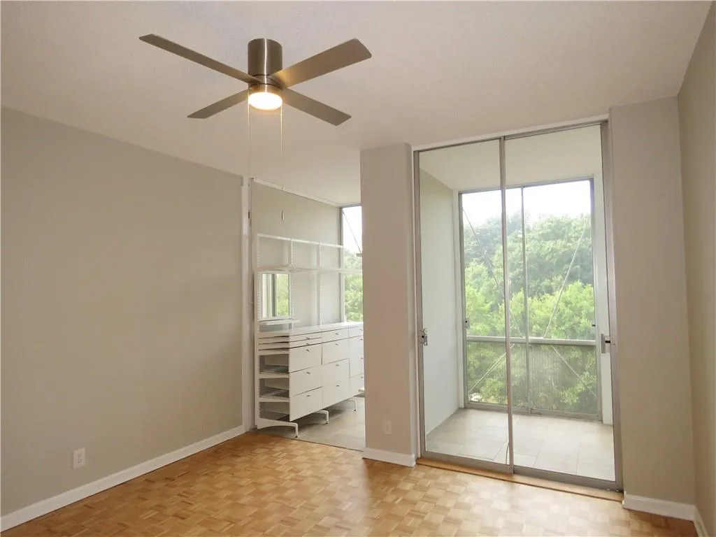 Sliding glass doors opening to a tiled balcony