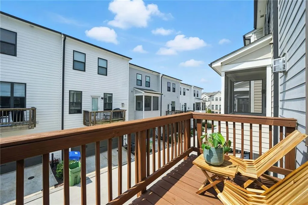 Wooden terrace featuring a residential view