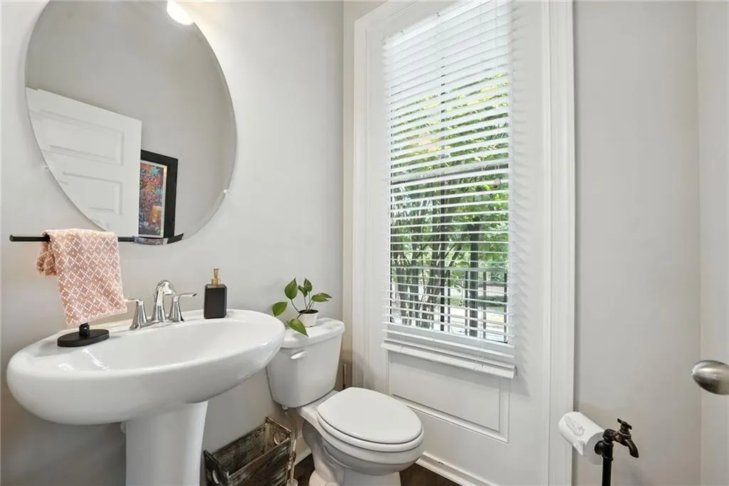 Half bathroom with healthy amount of natural light