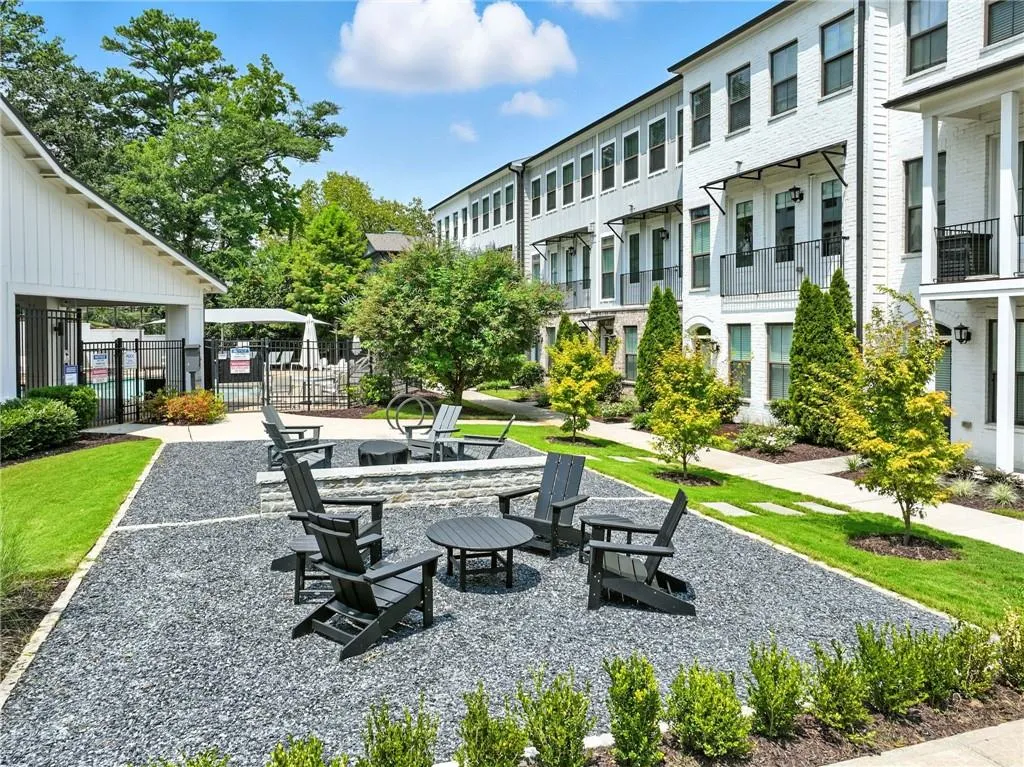 View of home's community featuring a residential view, a patio area, and an outdoor fire pit