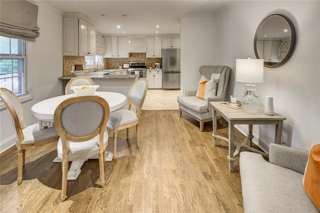 Dining area featuring sink and light hardwood / wood-style flooring