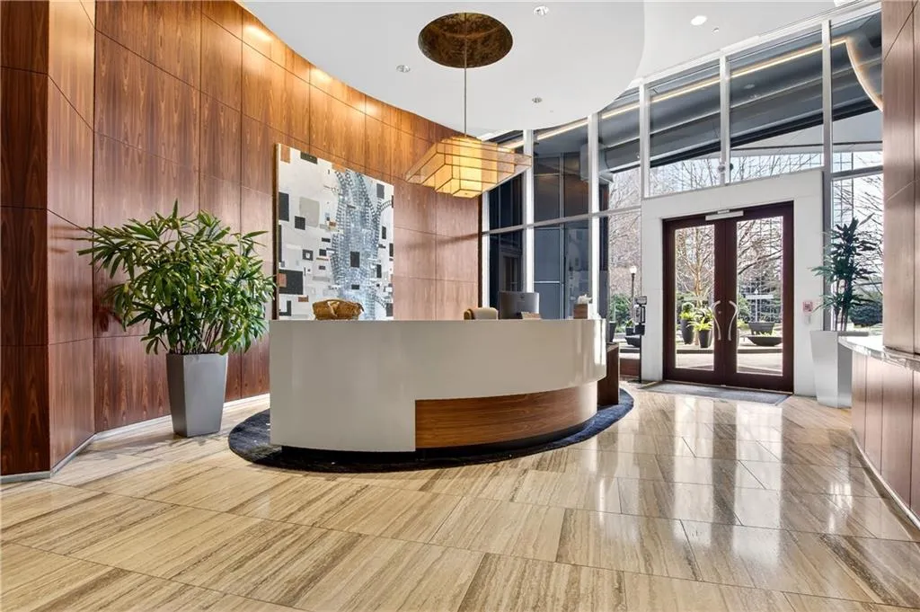 Reception area with french doors and a towering ceiling