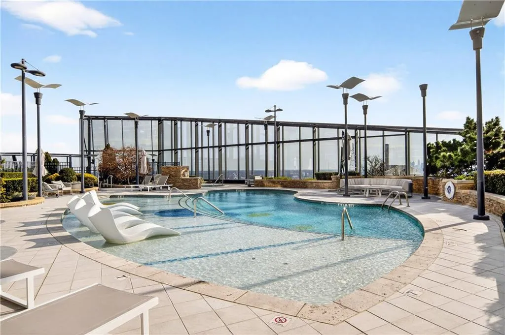 Community pool with a patio area