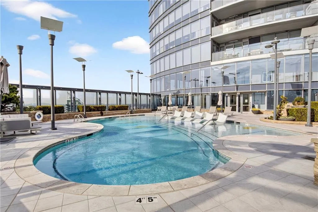 Community pool featuring a patio area