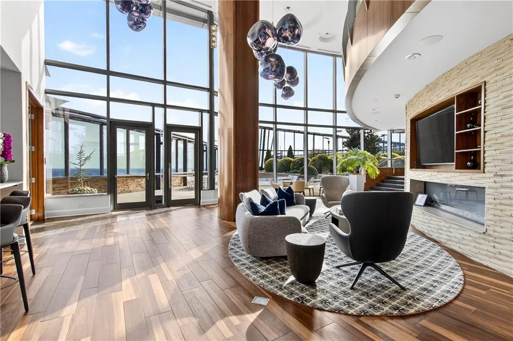 Lobby with a high ceiling and floor to ceiling windows