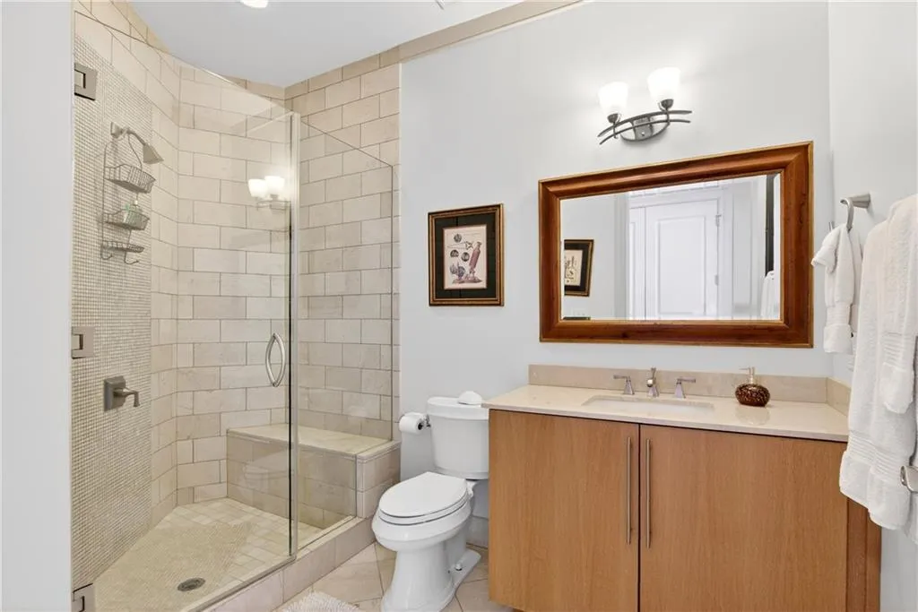 Bathroom featuring vanity and a stall shower