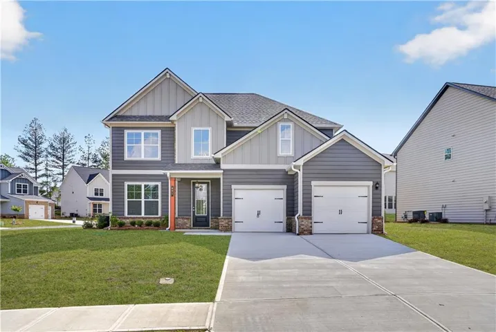 Two-story residence featuring a gray and light gray siding exterior with white trim