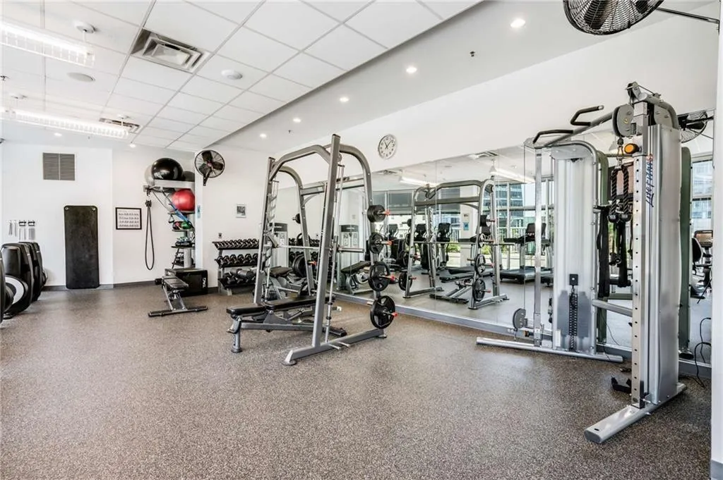 Exercise room featuring a drop ceiling