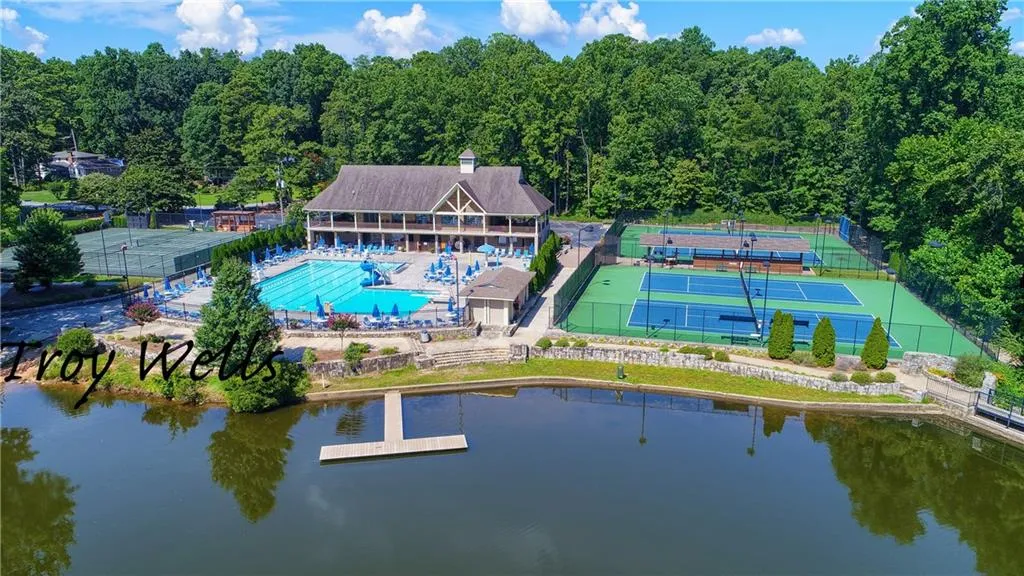 Aerial view of a large body of water and a pool area